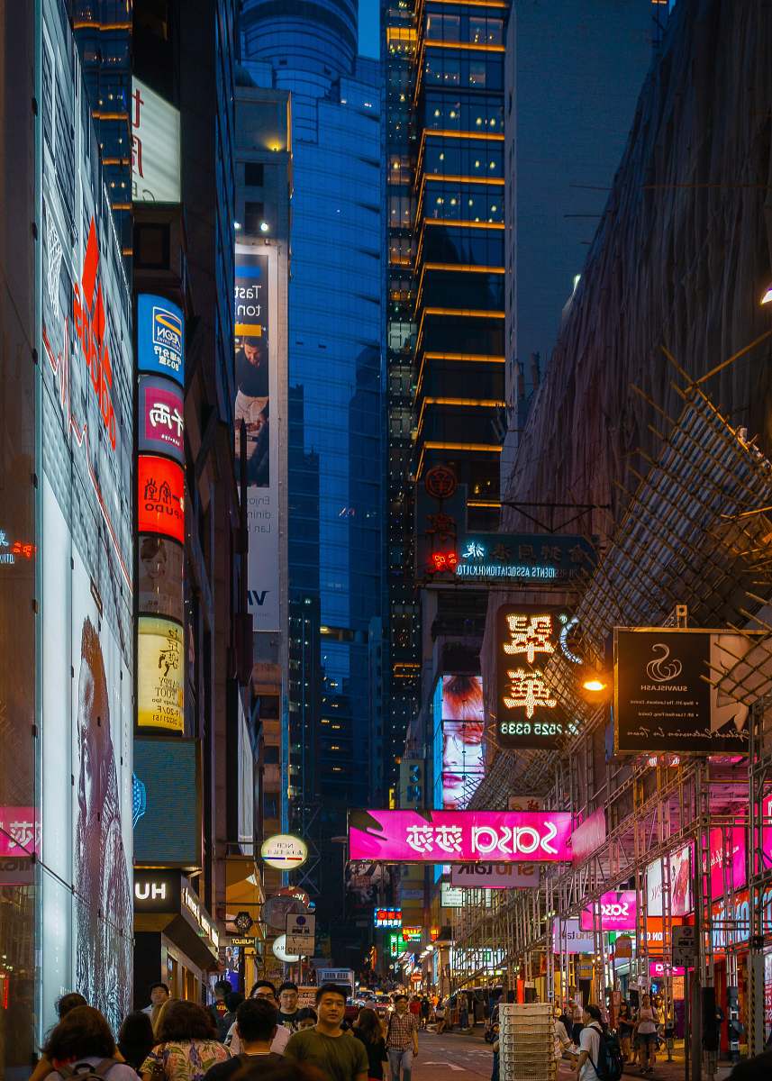 urban people in busy city street at night building