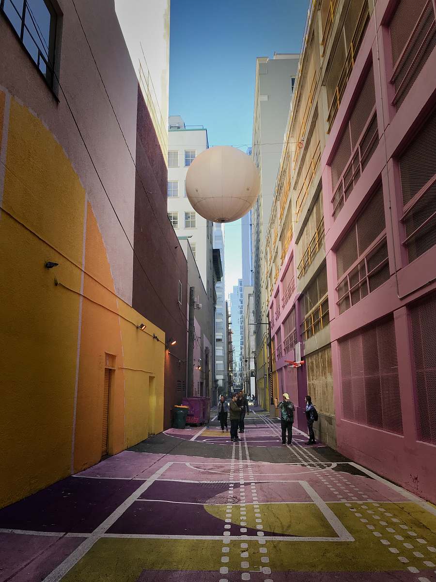 street people talking at the center of hallway town