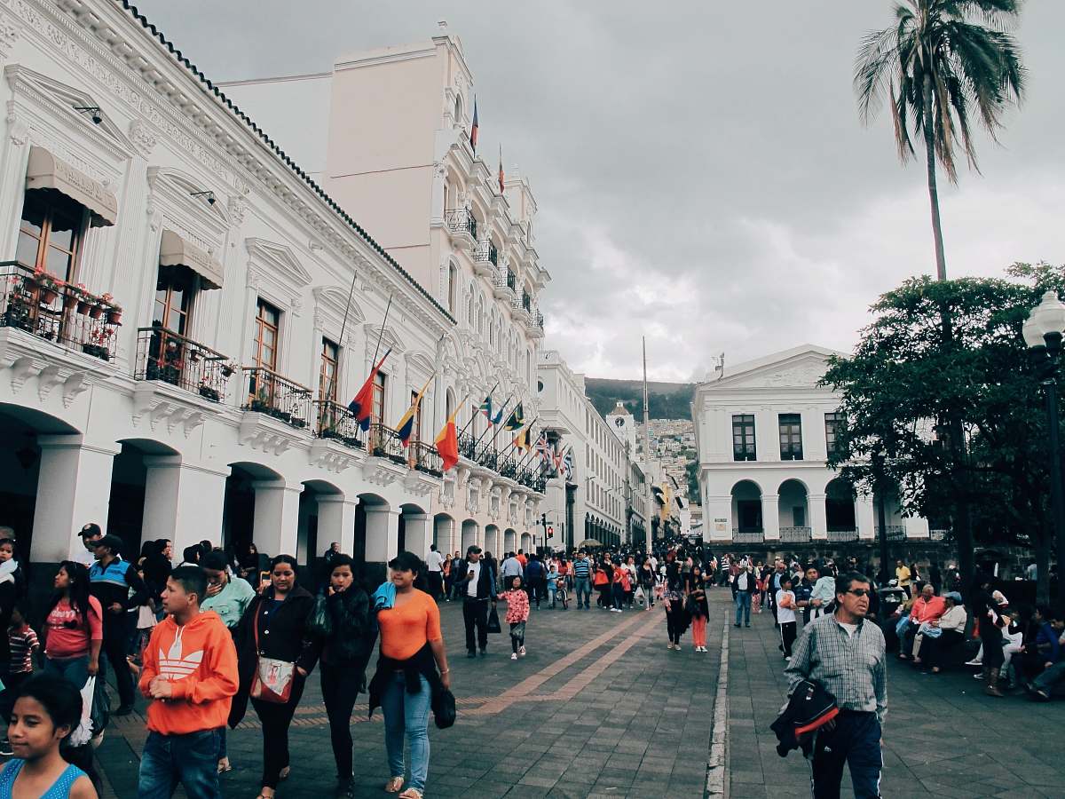 urban people walking beside building at daytime town