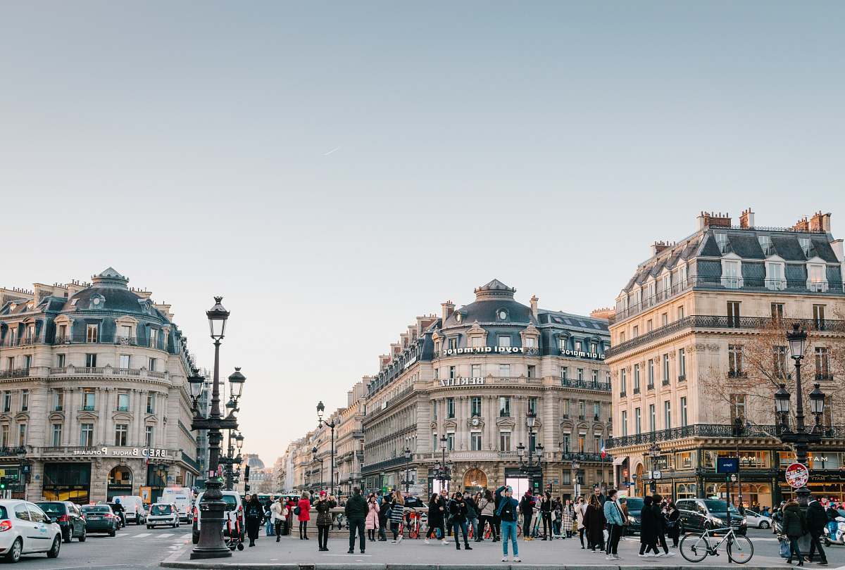 town people walking on street beside buildings urban