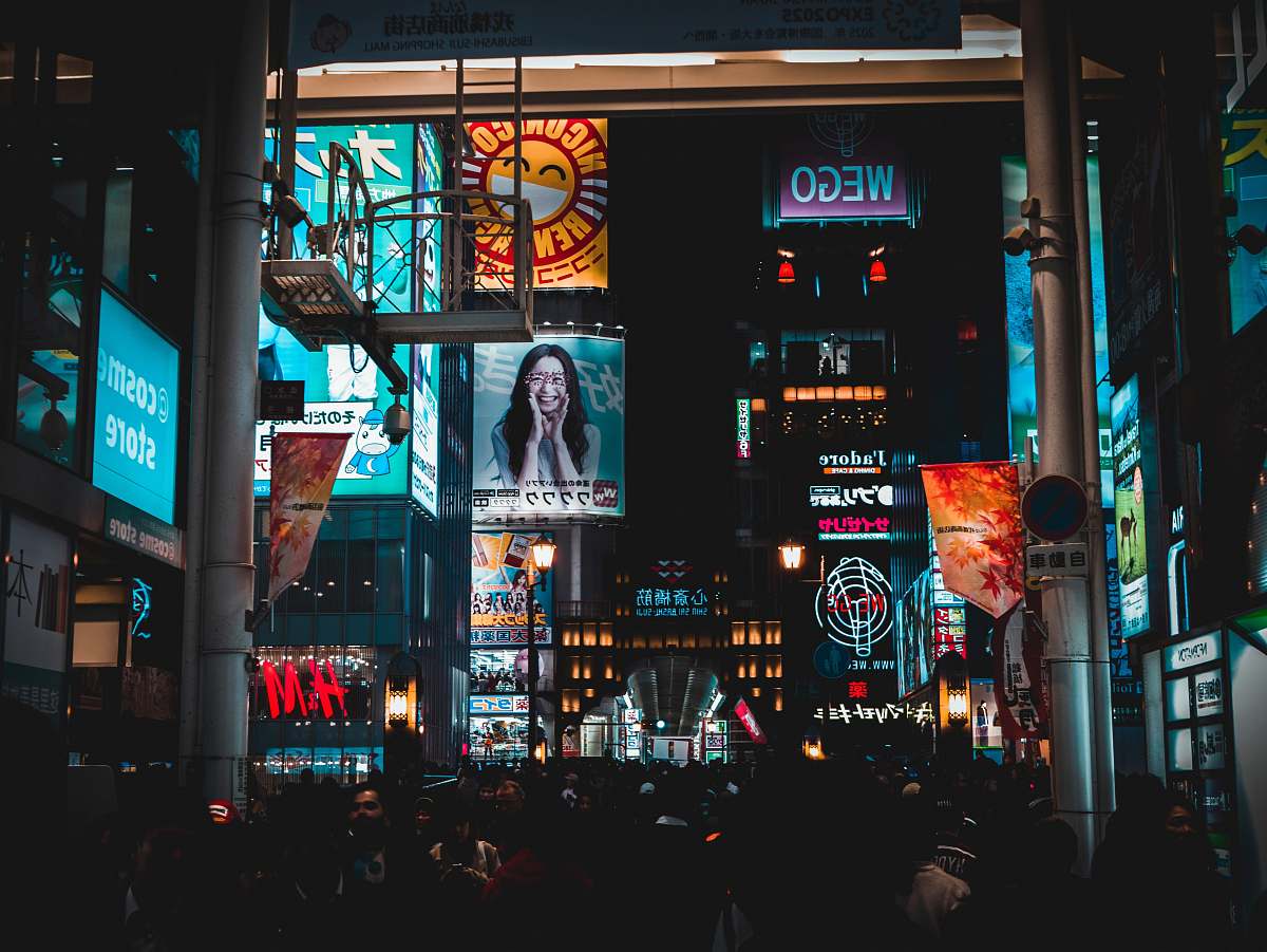 urban people walking on streets at nighttime metropolis