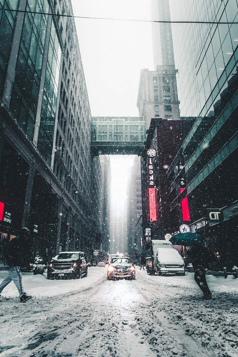 winter person walking on the street during day time urban