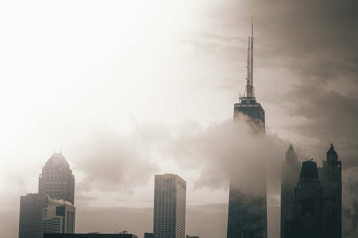 fog photo of building surrounded by clouds architecture