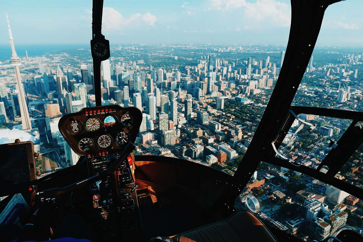 cockpit pilot taking photo of city urban