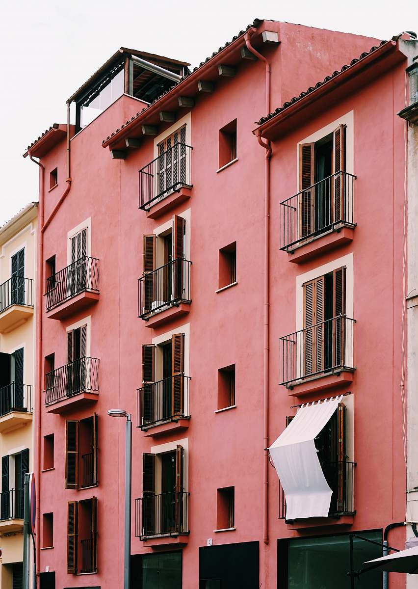 building pink painted aparment urban