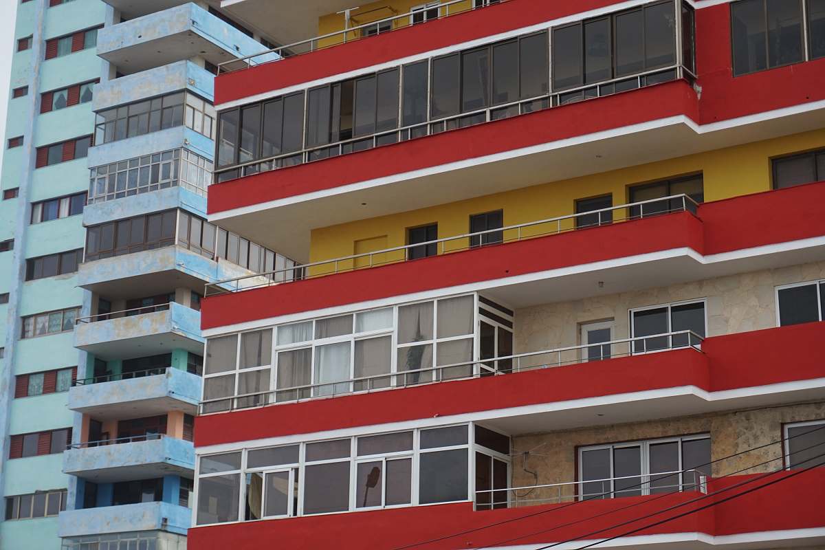 building red and white buildings high rise
