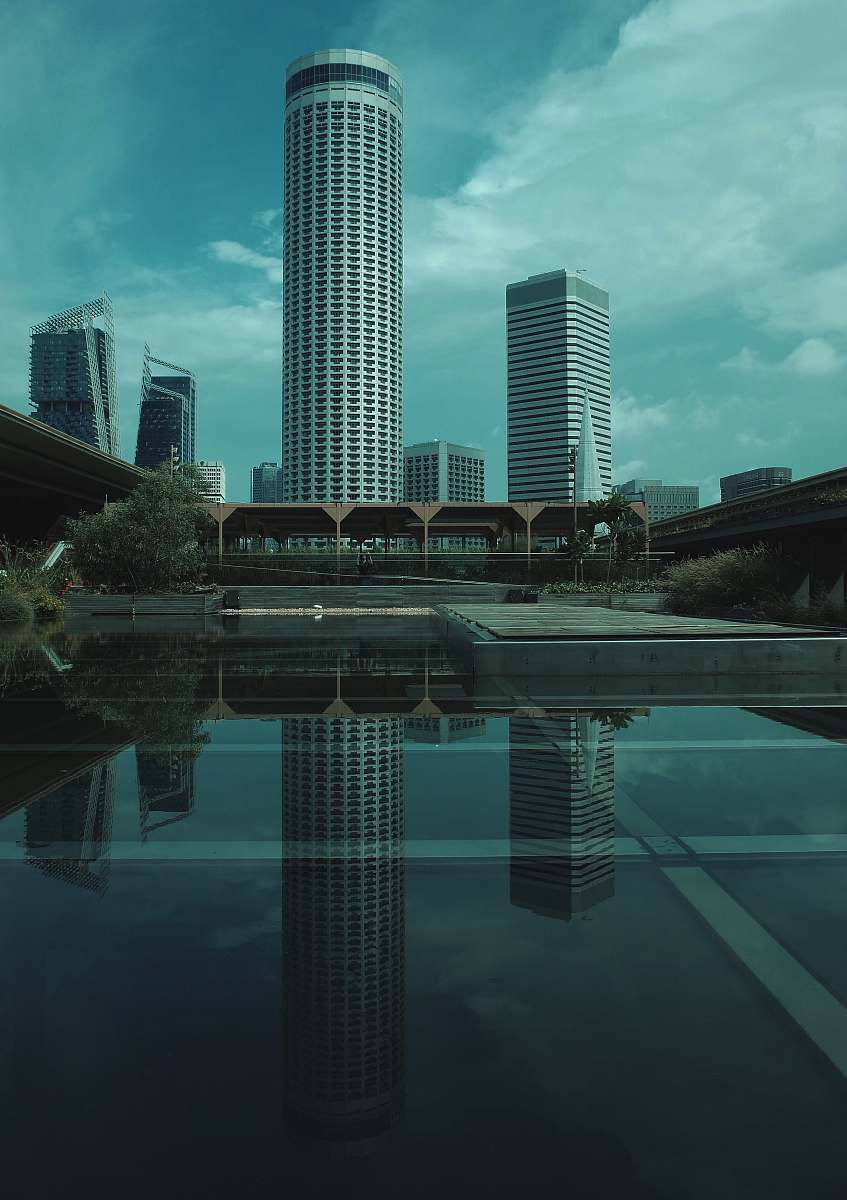 building reflection of high rise buildings on mirror floor town