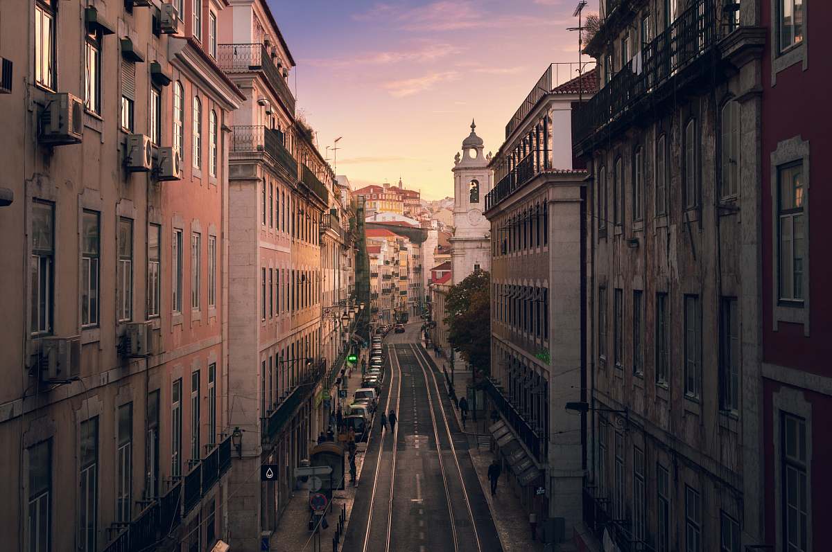 street road in them middle of large buildings lisbon