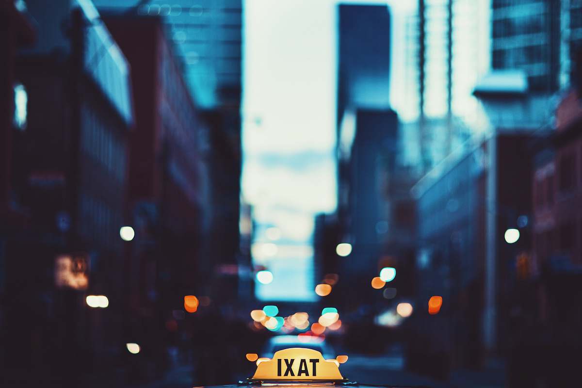 urban selective focus photography of taxi signage lights