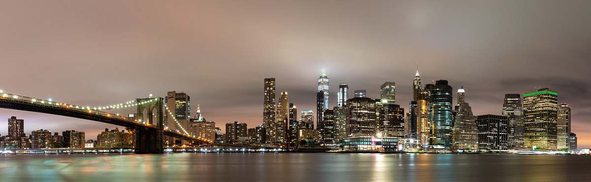 Capture the breathtaking beauty of a vibrant city skyline adorned with towering high-rise buildings against a stunning sunset backdrop. This image showcases the dynamic architecture and urban landscape, making it perfect for use in real estate marketing, city tourism campaigns, or as a striking backdrop for corporate presentations. Ideal for graphic designers, web developers, and businesses looking to evoke a sense of modernity and urban life.