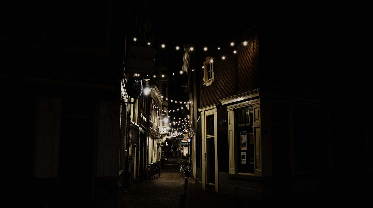 alley string bulbs on street by night street