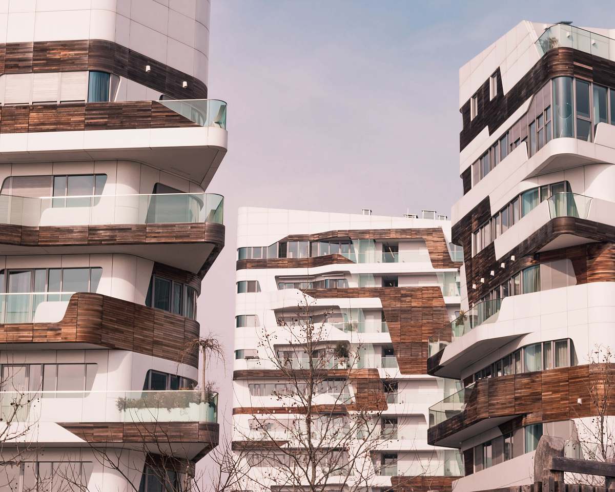 building three brown and white buildings high rise
