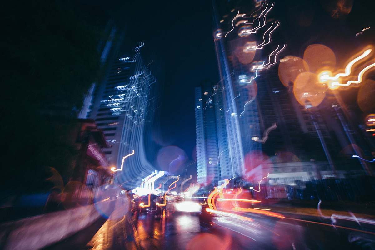 town time-lapse photography of street during night time metropolis
