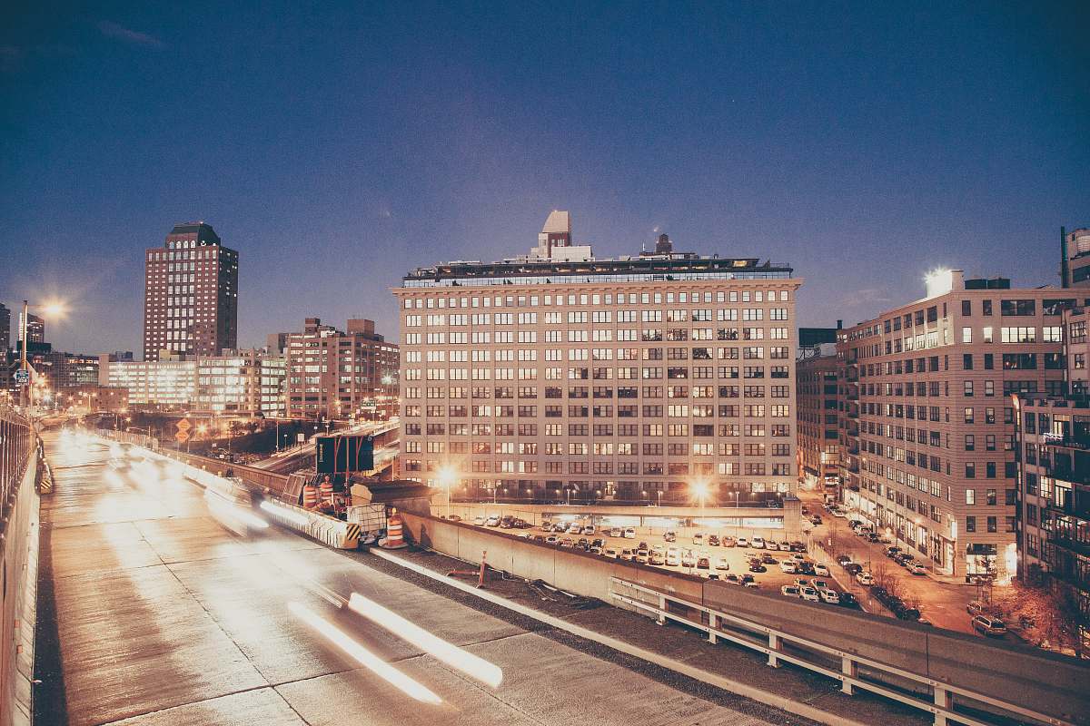 town time lapse photography of vehicles near building building