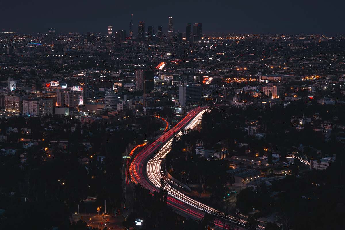 road timelapse photo of cityscape with lights urban