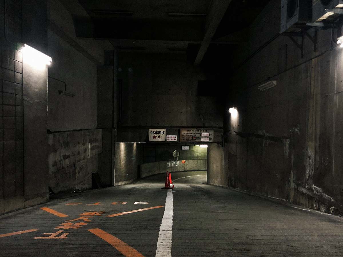 building traffic cone at the center of the road road