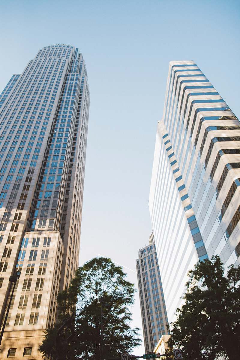 building two tall buildings during daytime office building
