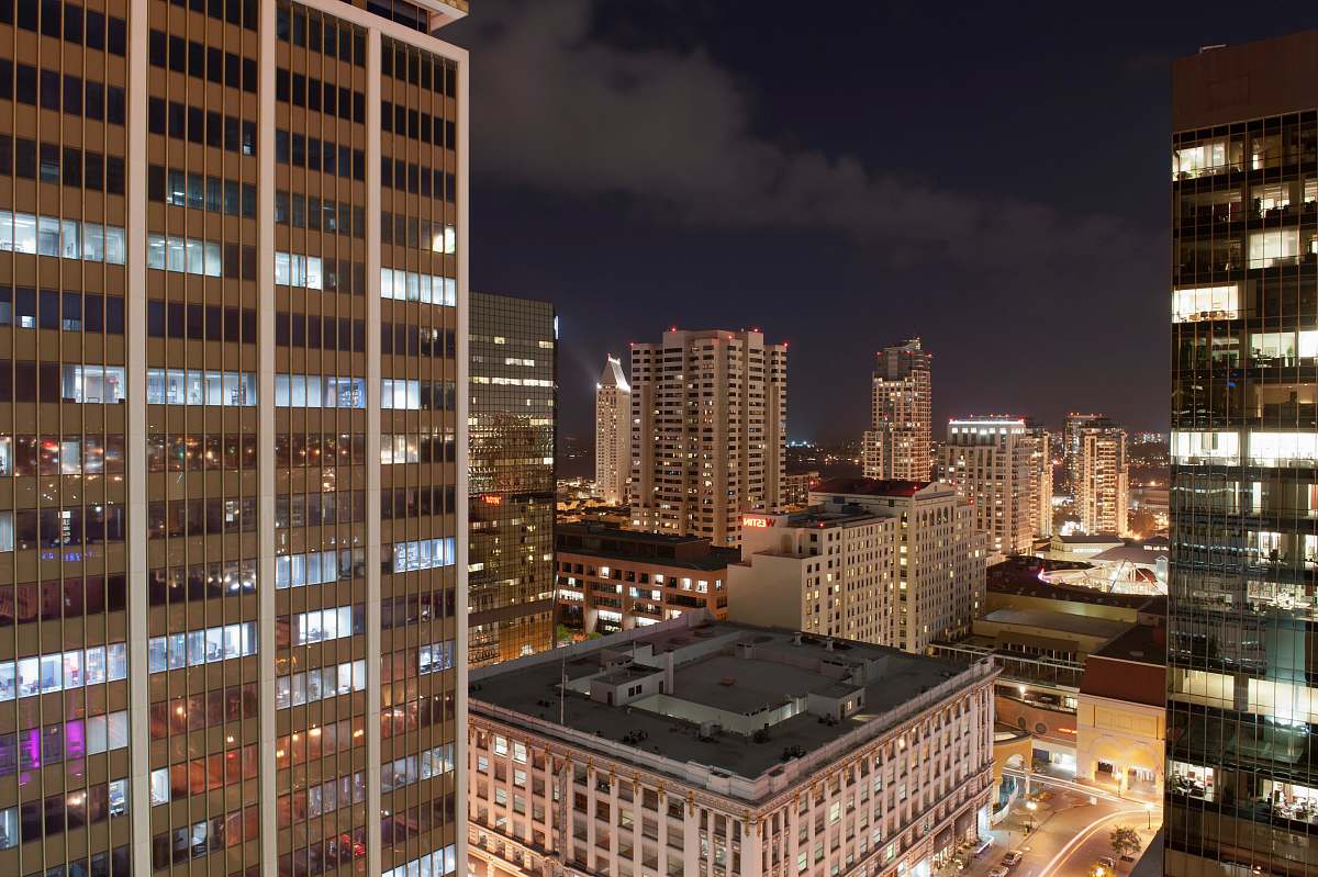 town urban photo of brown buildings at night urban