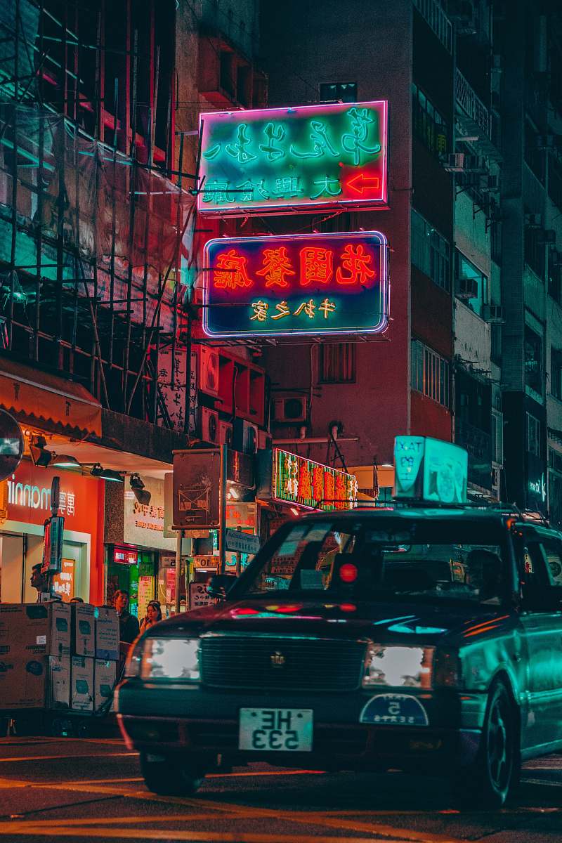 metropolis vehicle near building during nighttime urban