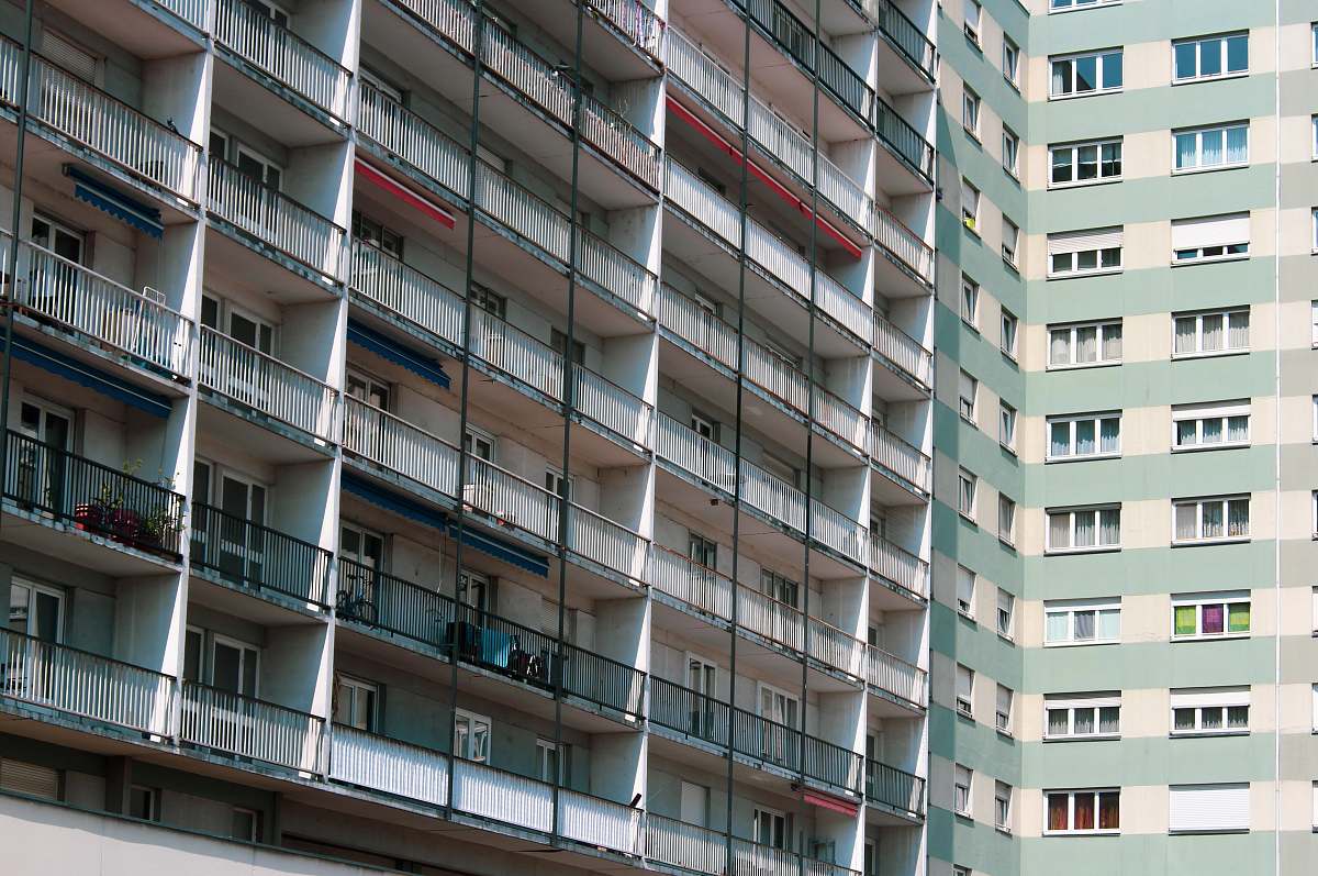 building white and green high-rise building high rise
