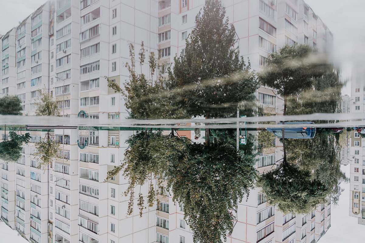 building white building near trees photo high rise
