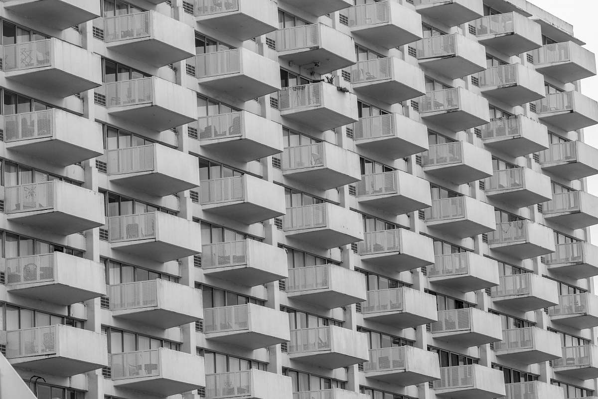 black-and-white white concrete building at daytime grey