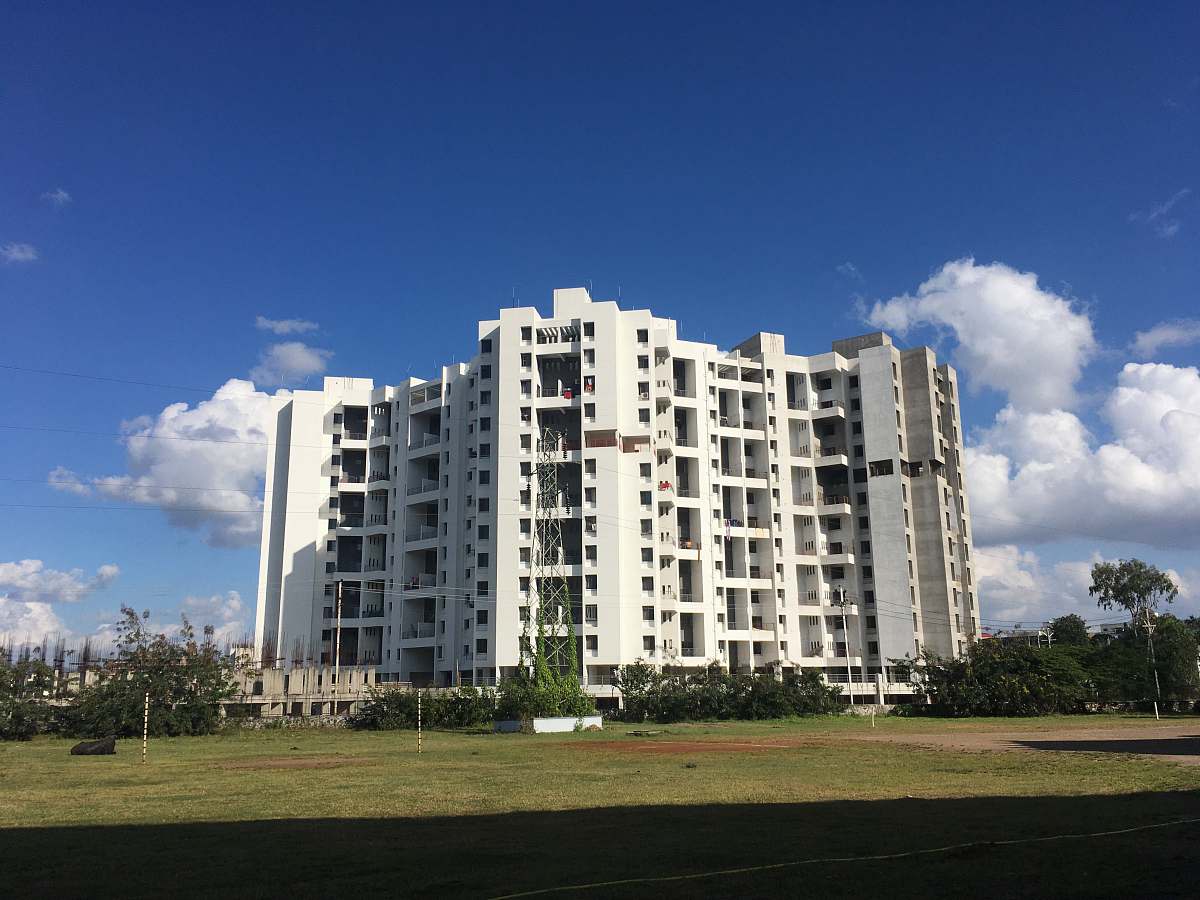 building white concrete high-rise building during daytime high rise