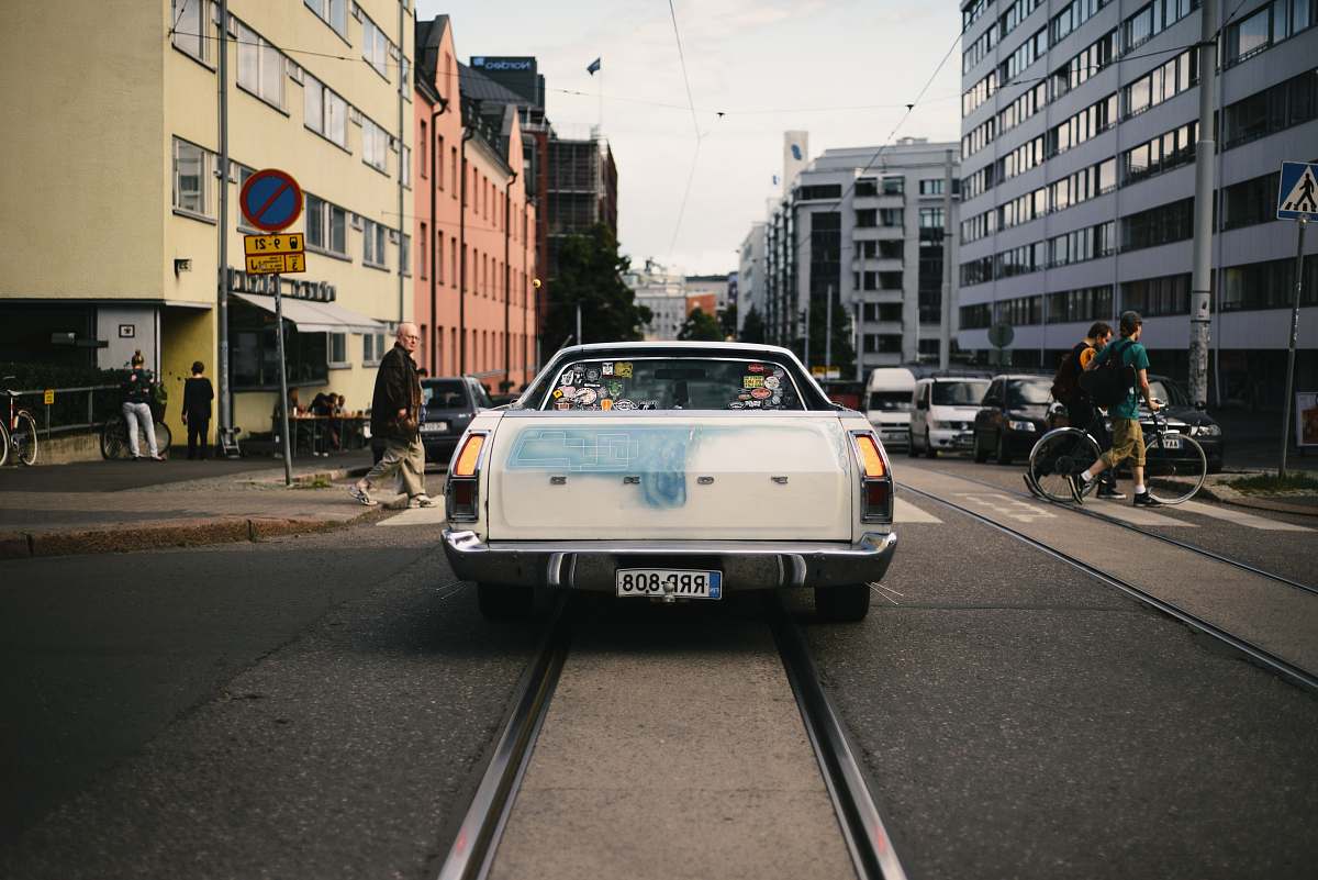 car white Ford car on road helsinki