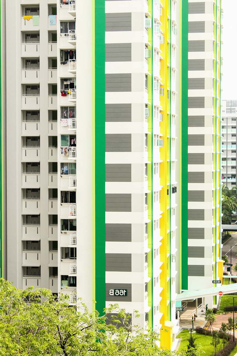 building white high rise buildings over the trees high rise