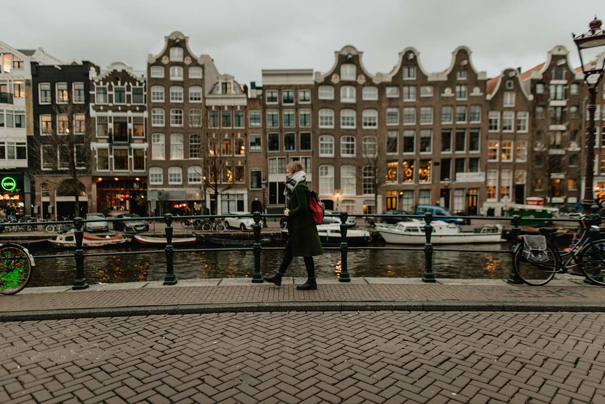 person woman walking beside canal human
