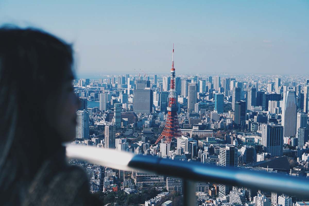building woman watching city building high rise