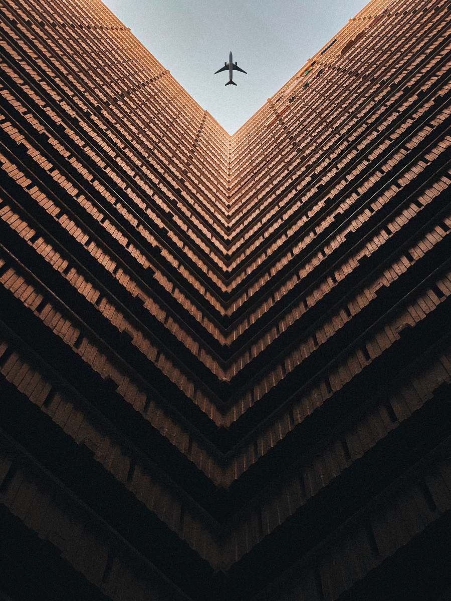 urban worm view photo of brown building during daytime town