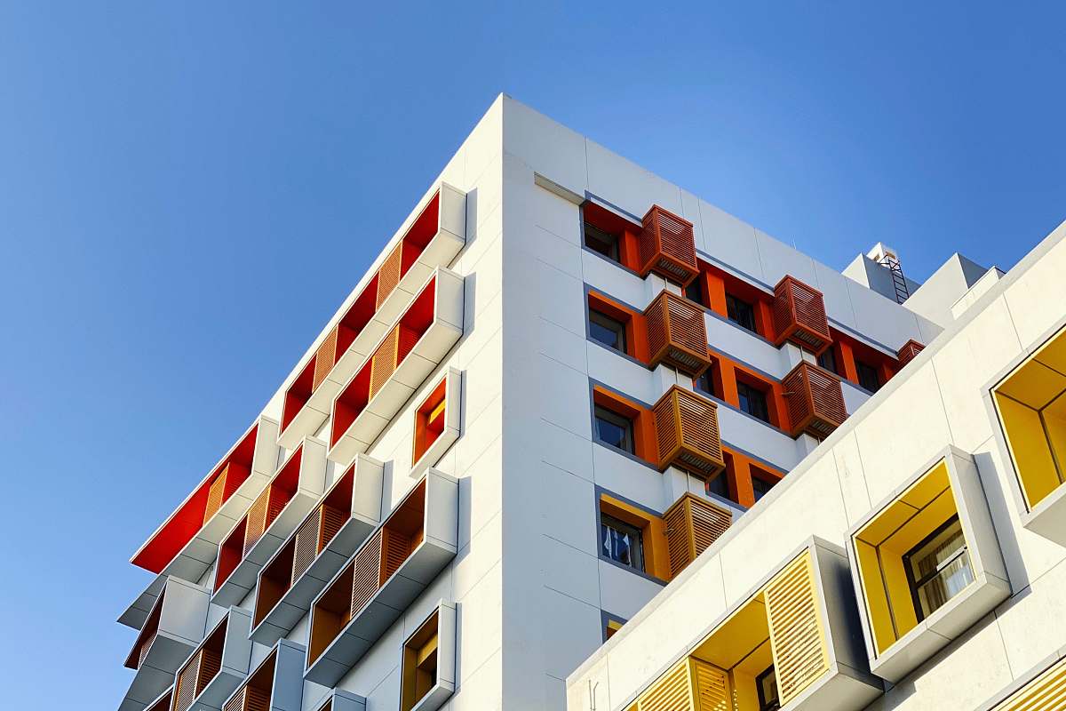 building worm view photo of white building during daytime urban