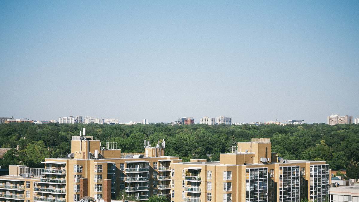 building yellow and black concrete buildings at daytime high rise