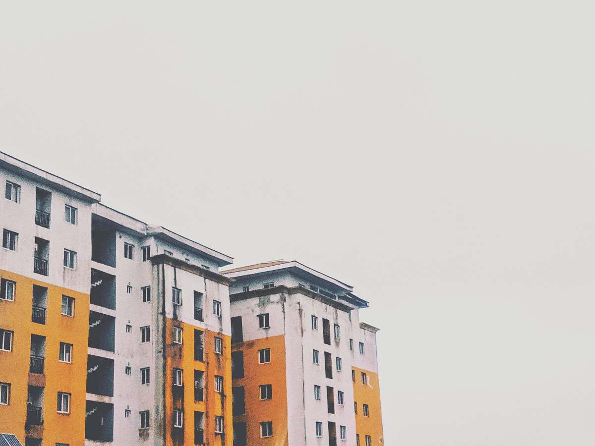 urban yellow and white concrete high-rise building town