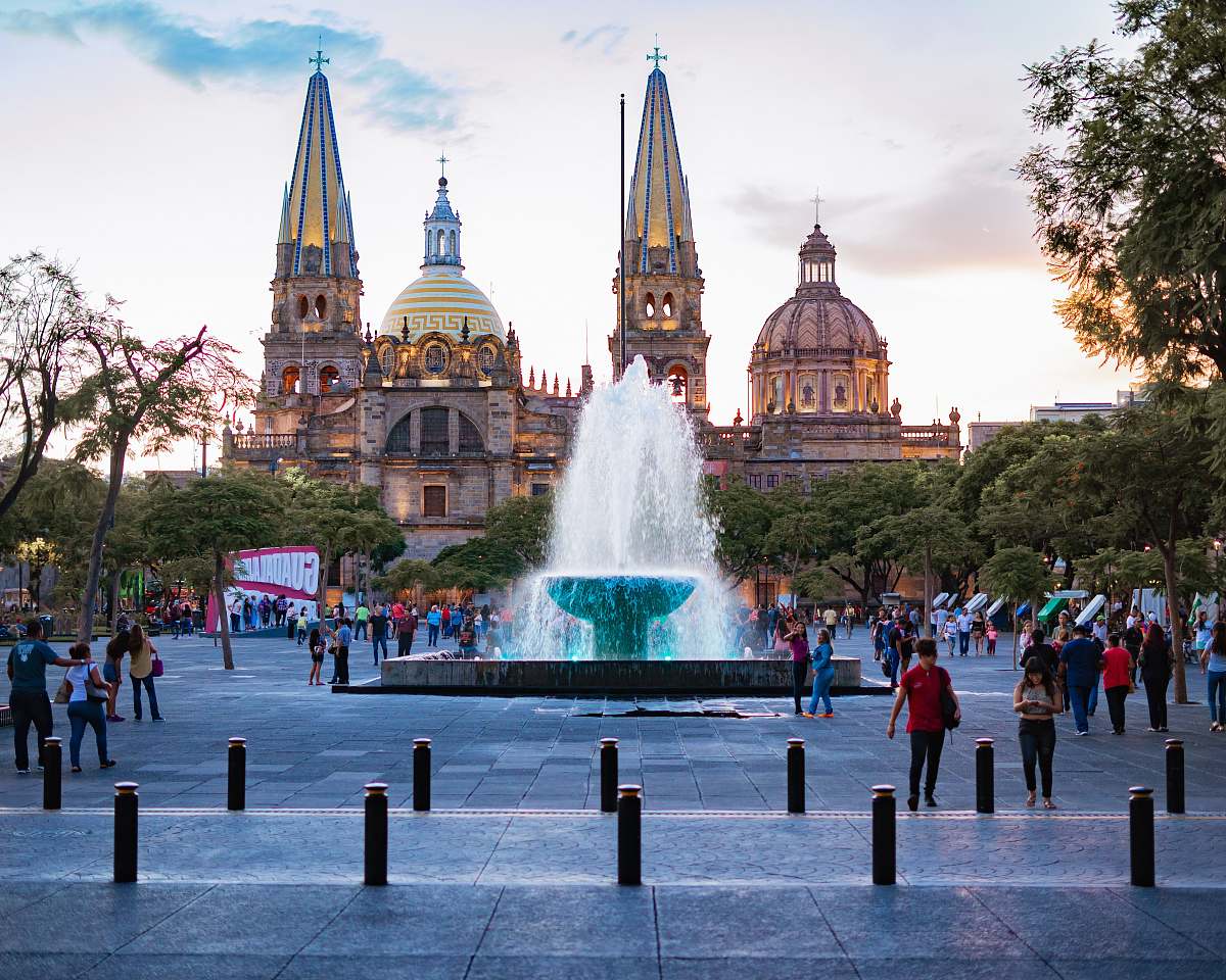 town people near water fountain urban