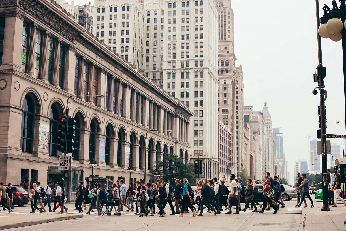 pedestrian people crossing on road during daytime person