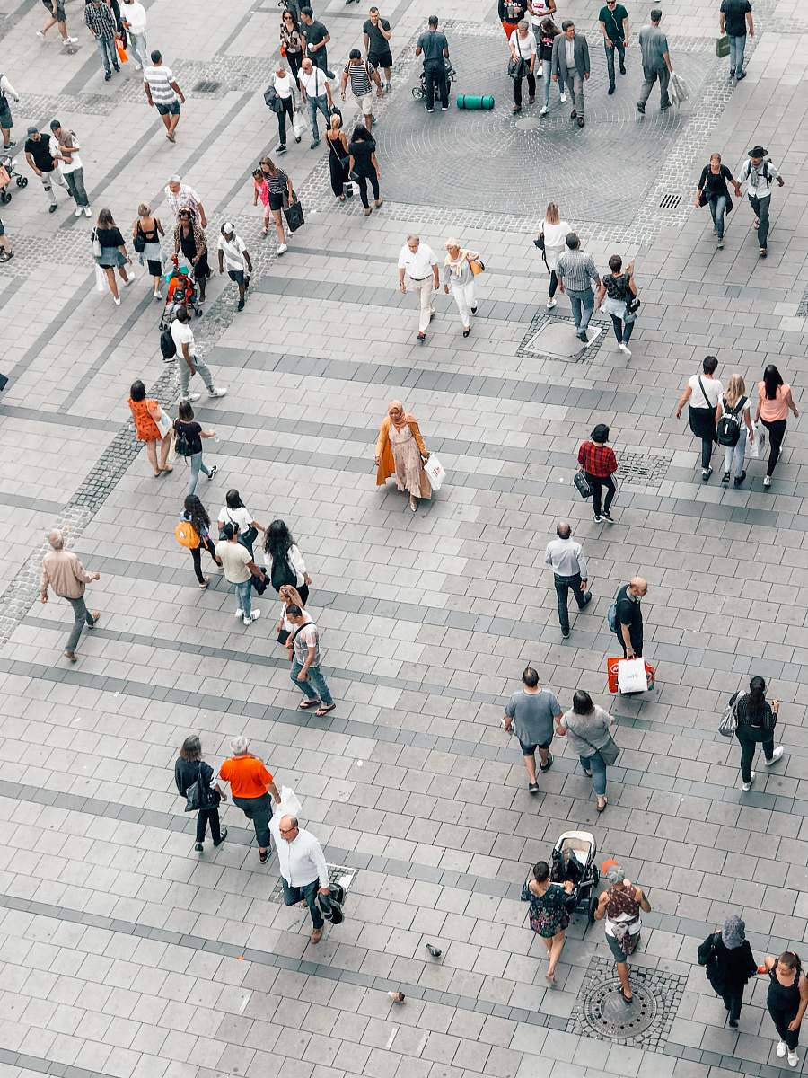 human people walking on gray concrete road pedestrian
