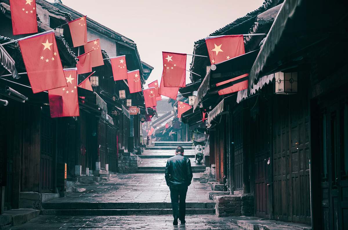 town man walking during daytime urban