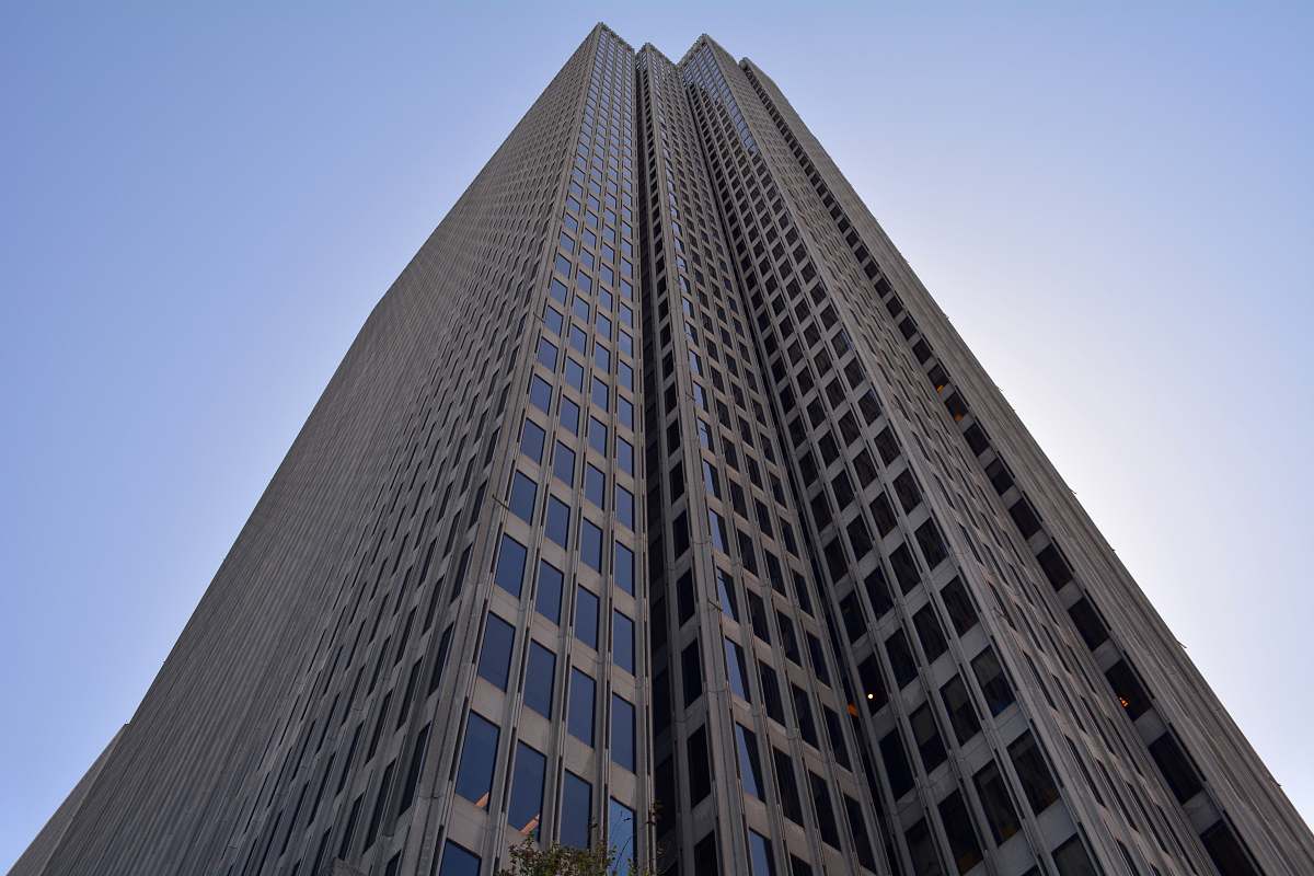 city brown high-rise building with clear blue skies building