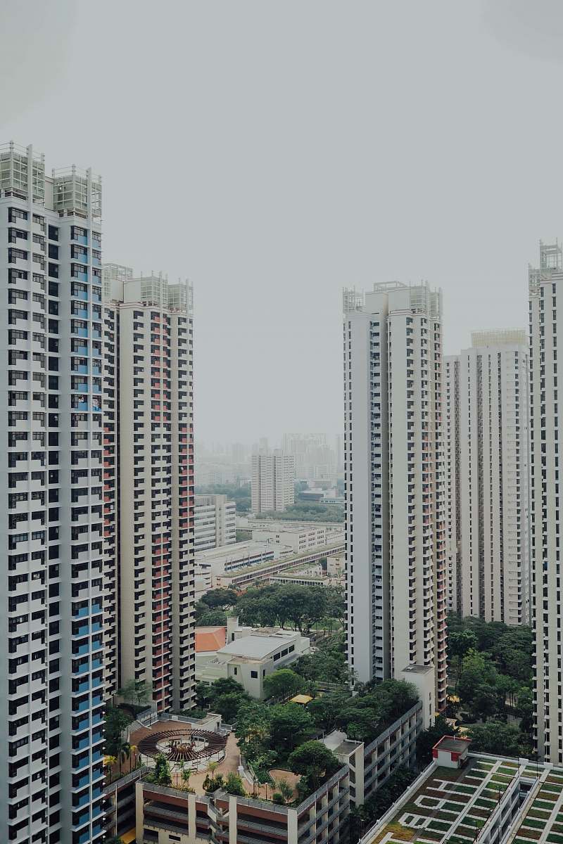 town high-rise buildings under white sky building