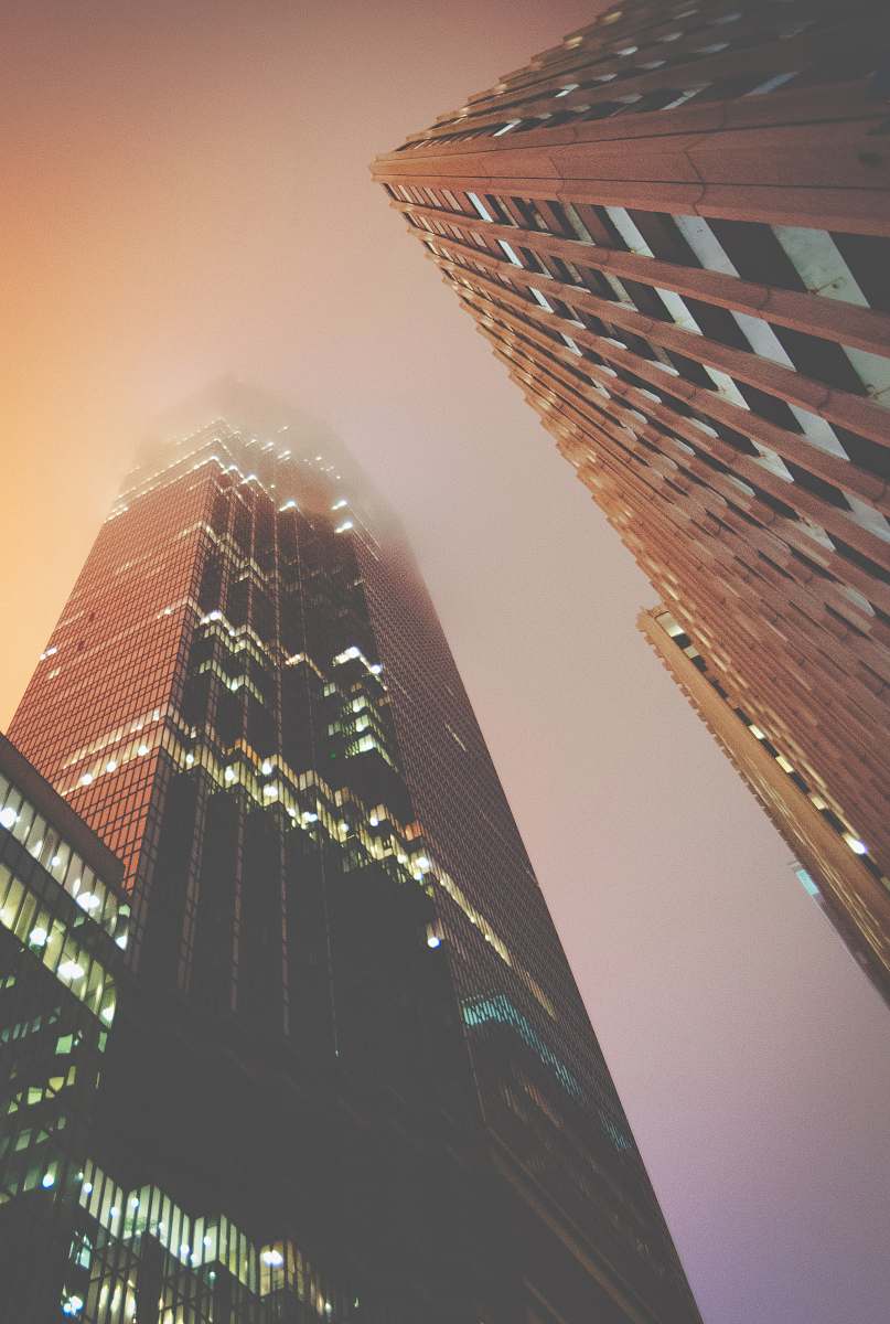town low angle photo of high rise buildings building
