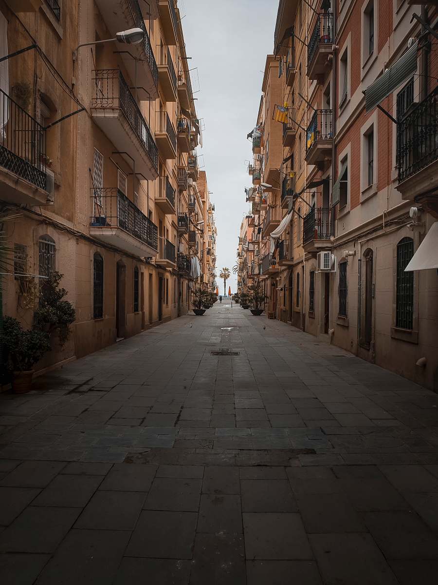 street narrow pathway between houses flagstone