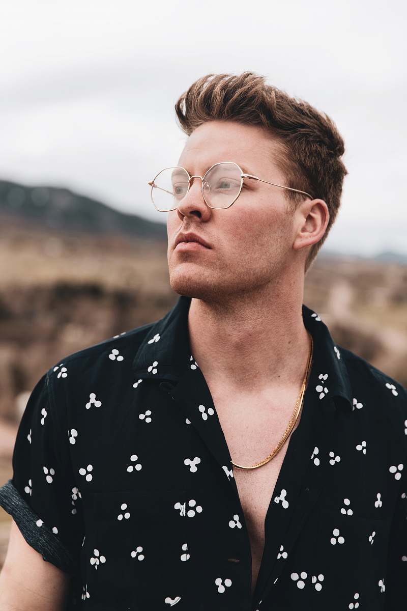 accessory man in black and white floral shirt wearing eyeglasses glasses