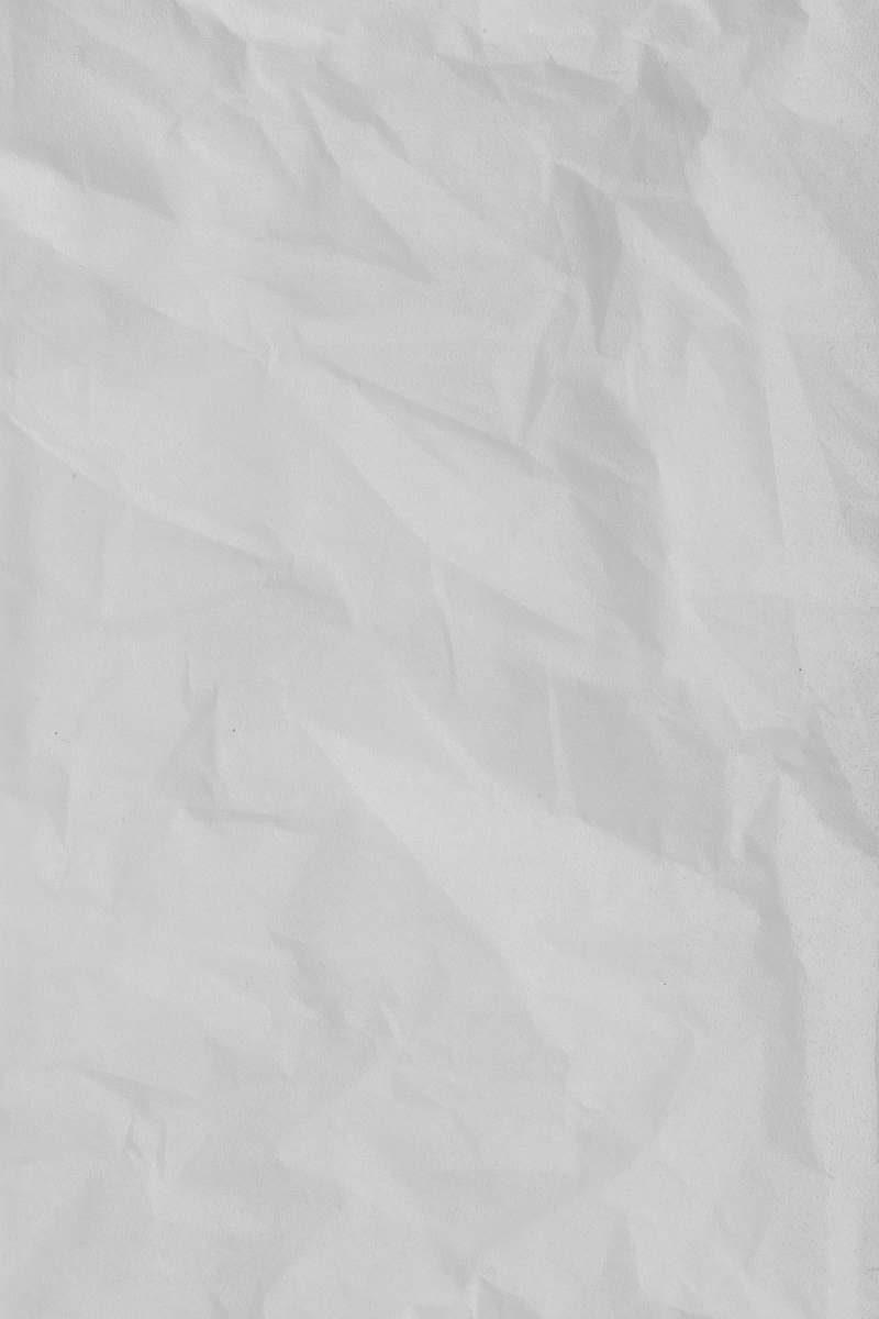 grey white textile on brown wooden table paper