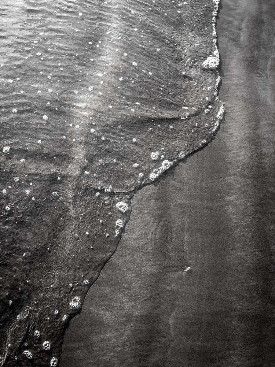 black-and-white seashore during day uk
