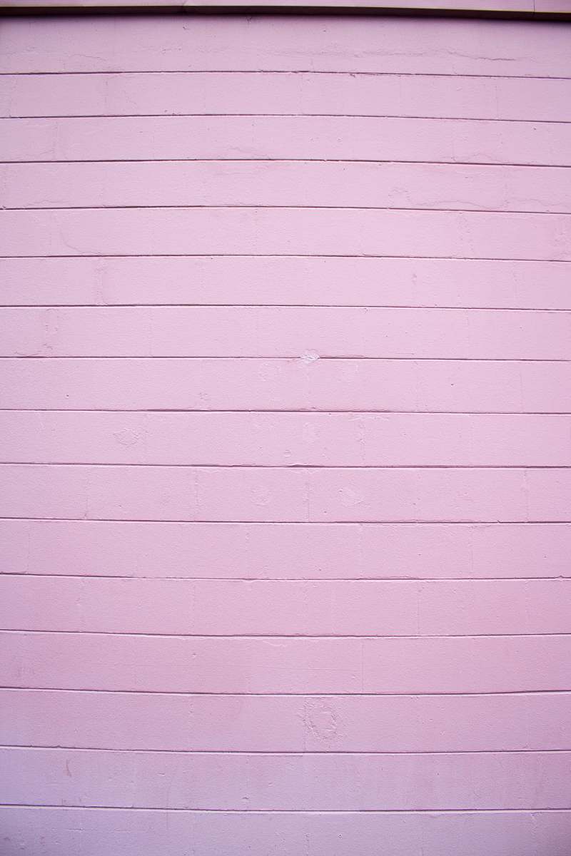 pink close shot of white wooden wall wall