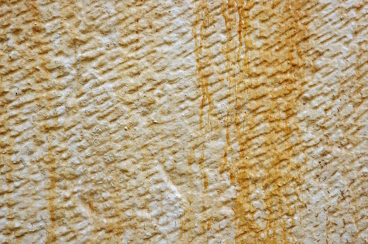 texture yellow stained white wall paint brown