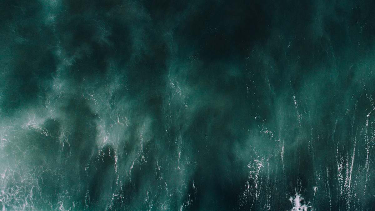 grey aerial photograph of green water ocean