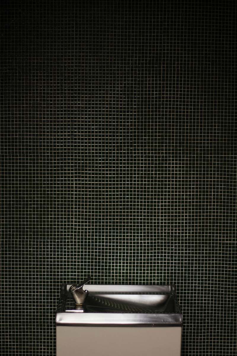 grey gray stainless steel drinking fountain is empty fountain